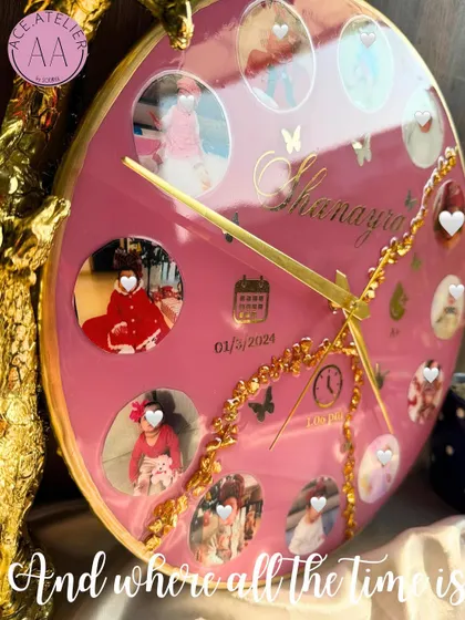 A side view of the custom baby clock, showing the glossy finish and the depth of the resin. The gold details and butterfly accents add a touch of magic.