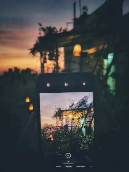 Capturing the magic within the magic. This is a photo of my phone capturing the garden at sunset, a reminder to always find and appreciate the beauty in every moment.