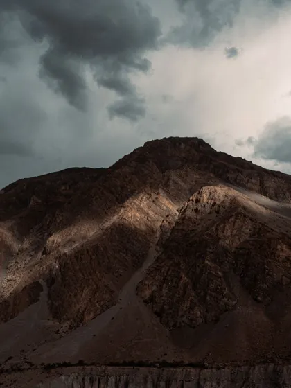 Sunlight breaking through the clouds to illuminate parts of the mountain range. Chasing this kind of dramatic light is what makes landscape photography so thrilling.