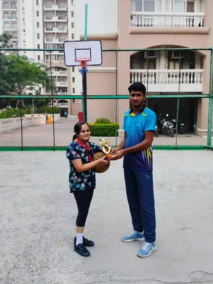 Another proud player receiving her trophy at our Ranking Day event.