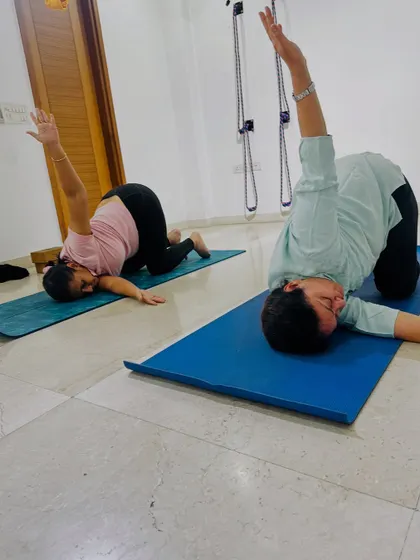 Students practice a spinal twist, a great way to release tension in the back. My passion is fueled by seeing my students show up for themselves and embark on a journey of transformation.