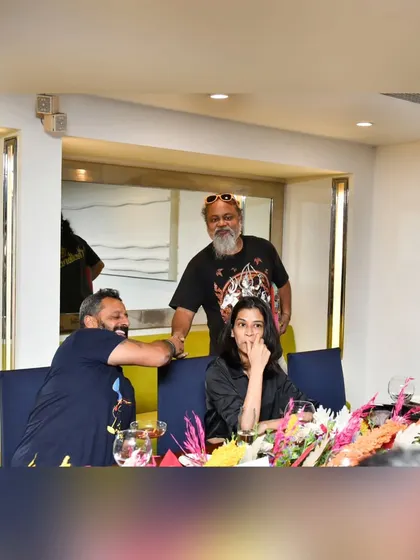 A candid moment of conversation and connection between guests at our exclusive dining event. We foster a sense of community around our shared love for food.