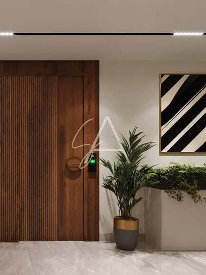 Detail of a fluted wood door and minimalist planter in the office corridor. We believe small details and material choices are key to creating a cohesive and high-end design.