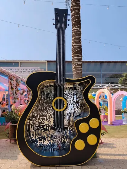 Make your music-themed event a hit with our giant guitar photo booth. The interior is lined with a dazzling mosaic of mirrors, creating a unique and glamorous spot for guests to take pictures at a sangeet, birthday, or corporate party.