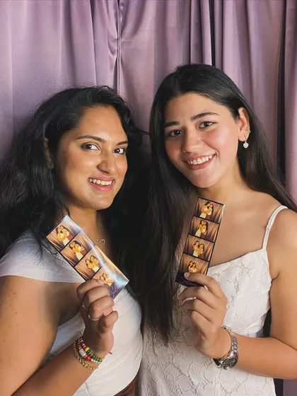 Two friends, two different styles of photo strips from the same event.