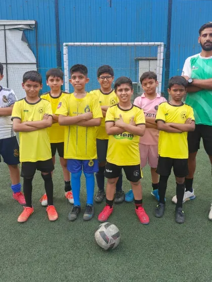 A group photo of one of our weekend batches with their coach. We provide a structured and fun environment for players of all levels.