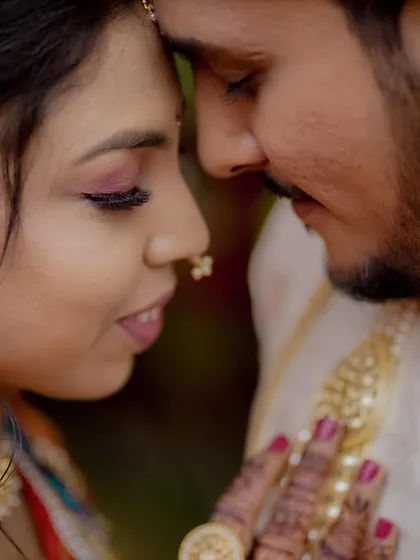An extreme close-up capturing the intimacy and emotion between the couple, their faces close together in a tender moment.