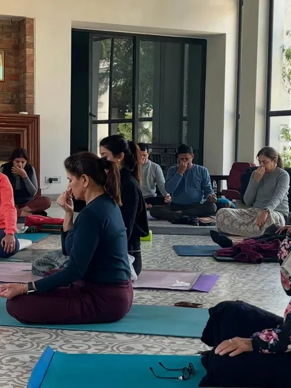 Participants practicing pranayama at my Om Yoga shala. I believe yoga is a process of replacing old patterns with new, more appropriate ones, helping us meet our best selves.