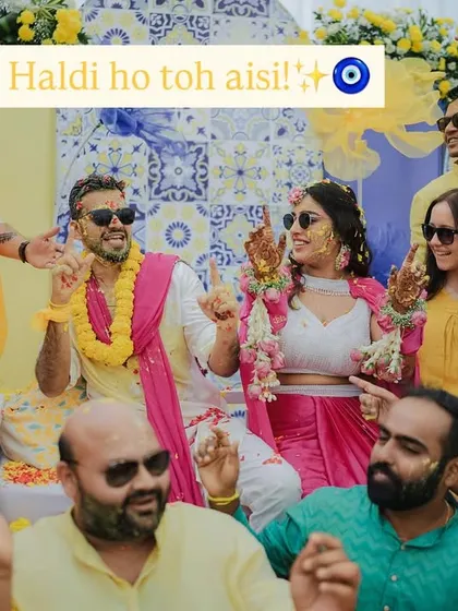 "Haldi ho toh aisi!" A perfect group shot capturing the fun, energy, and love of friends and family celebrating the happy couple during their Haldi ceremony.