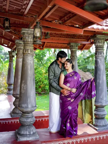 A tender moment under a traditional-style gazebo. This pre-wedding shot is full of grace and quiet love.