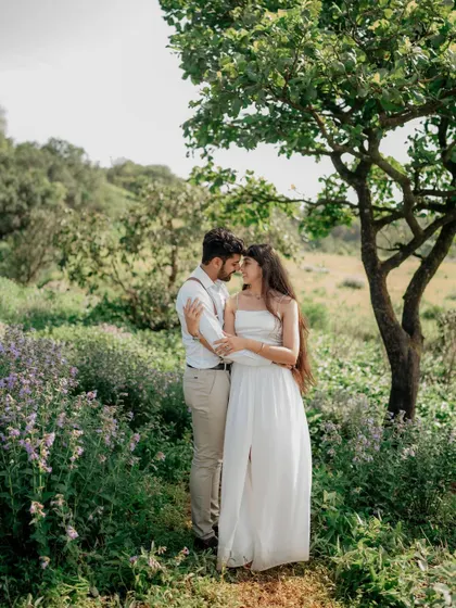 A classic romantic pose under a tree. The soft light and natural surroundings make this a timeless pre-wedding portrait.
