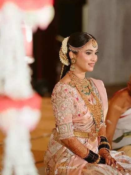 A beautiful portrait of the bride. The intricate embroidery on her pastel blouse and her stunning jewelry complete her breathtaking bridal look.