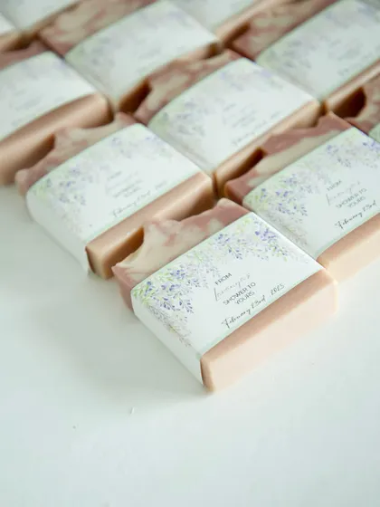 Another angle of the custom baby shower soaps, laid out to show the consistent and thoughtful packaging.