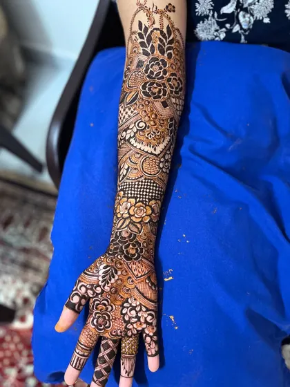 Another angle of the same bridal henna, highlighting the detailed work on the inside of the arm.