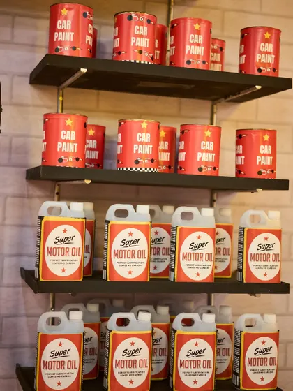 No detail is too small. I created these custom-labeled "Car Paint" and "Super Motor Oil" props to fully flesh out the garage theme.
