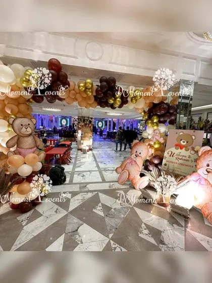 A grand entrance for the teddy bear Mundan ceremony, with a large balloon arch and oversized, adorable teddy bear props.