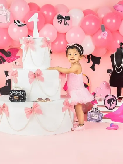 A sweet pose next to the giant prop cake in our all-pink Barbie world.