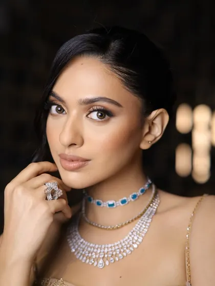 The "Golden Hour Hold" look, designed to last all night. This image showcases the radiant, long-lasting makeup, perfect for a reception or evening party.