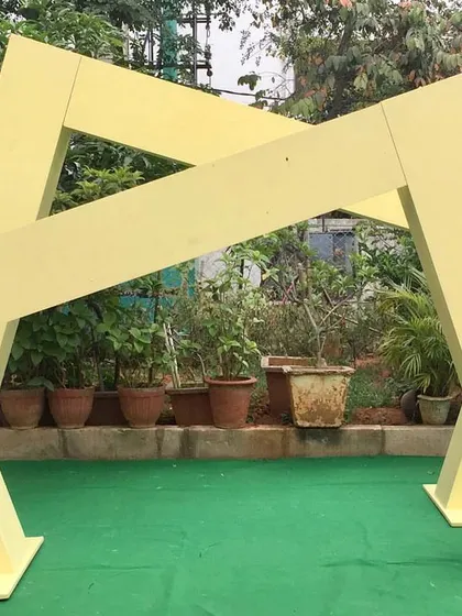 By combining two of our abstract sloping box panels, you can create a dynamic, overlapping archway. This configuration adds architectural interest and a modern flair to your event entrance or photo area.