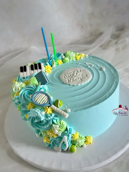 All of her favorite things! A cake for a teen who loves music, tennis, and reading, with little edible toppers representing her hobbies.
