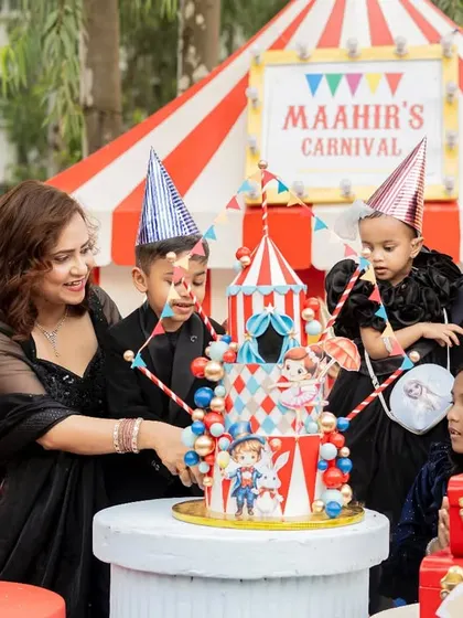 The whole family joins in for the cake cutting at "Maahir's Carnival." We love creating events that bring families and friends together for a day of fun and celebration.