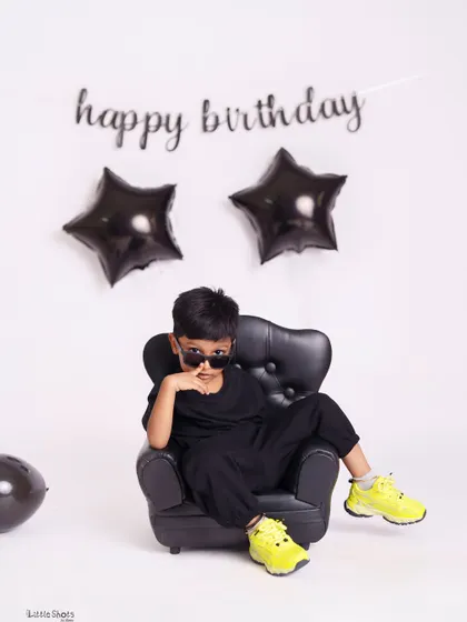 The definition of cool. This little boy's relaxed pose and stylish look make for an awesome and personality-filled birthday photo.