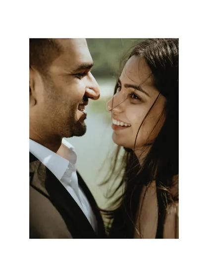 An intimate close-up of the couple, capturing the spark and affection in their eyes as they gaze at each other during their outdoor pre-wedding session.