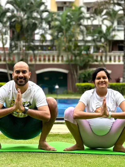 We proudly offer specialized prenatal yoga for expecting mothers. Here, a couple practices Malasana (Garland Pose) together, a wonderful way to prepare the body for childbirth and connect with each other during this special time.