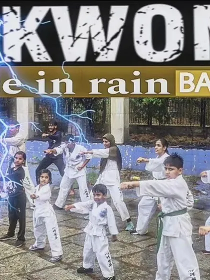 A promotional image for our YouTube channel, showing our students training with dedication even in the rain.