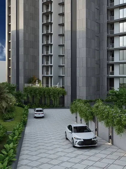 The ramp driveway of our Bandra residence, flanked by lush landscaping. This detail illustrates our approach to creating a seamless arrival experience, where nature and sophisticated architectural design converge.