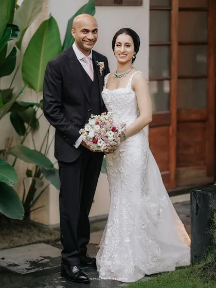 A classic portrait of the elegant bride and groom, ready to celebrate their union. Their poised and happy expressions tell a story of love and commitment.