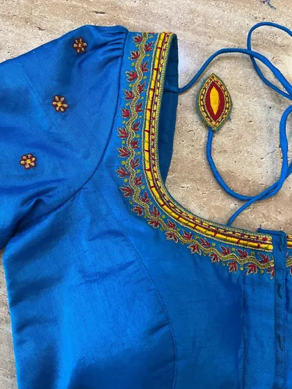 A duplicate image of the blue puff sleeve blouse.