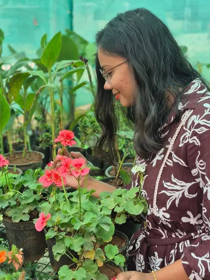 Finding a moment of peace among the flowers. Every plant in our garden center is chosen with care, and spending time here reminds me why we started this journey.