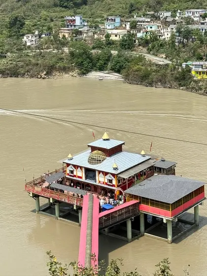 Exploring unique sights along the way. This is a view of a local temple near the river, one of the many interesting places we discover during our road journeys in Uttarakhand.