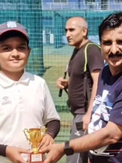 A player receiving an award from a parent, highlighting our community involvement.