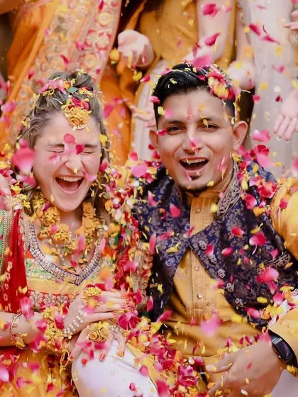 A joyous moment of a flower shower at Shashvat and Cossette's haldi ceremony.