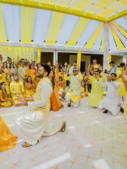 The groom's proposal during the Haldi ceremony, surrounded by cheering friends and family. A truly memorable moment.