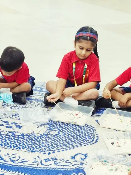 Young paleontologists are hard at work, carefully sifting through the dig site to find hidden dinosaur fossils. It's a great sensory and learning activity.