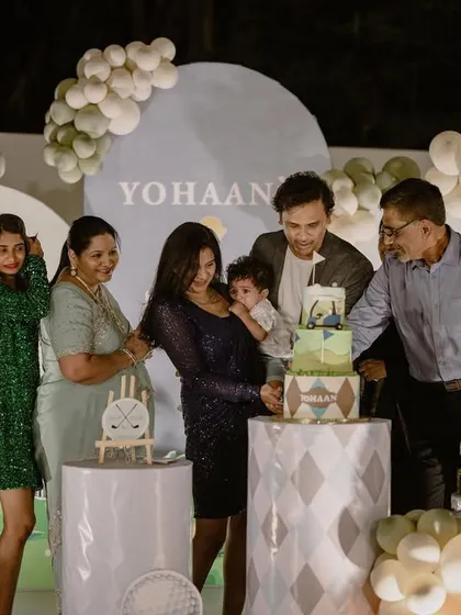 The cake cutting ceremony at the golf-themed party, complete with sparklers for a dramatic effect.