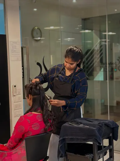 From mannequins to real clients, our students transition smoothly. Here, a student practices her styling techniques on a live model in the salon.