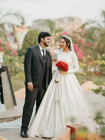 Another gorgeous shot of the couple. Her regal look, complete with a crown and red roses, is fit for a queen.