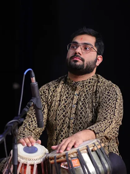 A moment of deep concentration during a live tabla performance. When I play, it feels like speaking a language without words, a sentiment beautifully expressed by the great Anindo Chatterjee.