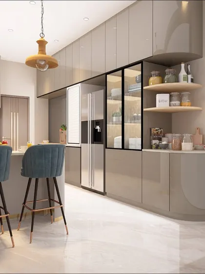 Another angle of the sleek grey kitchen, showing the ample storage provided by the floor-to-ceiling cabinets and the elegant open shelving for spices and jars.