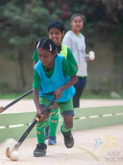 A young girl dribbles with speed and control during the 2022 camp, showing great potential.