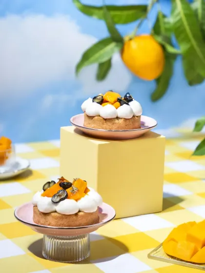We created this whimsical summer picnic to celebrate the magic of mango season. This shot is from a concept we designed from the ground up, using a surreal outdoor setting with bright, airy tones and minimal props to let the beautiful mango desserts be the hero.