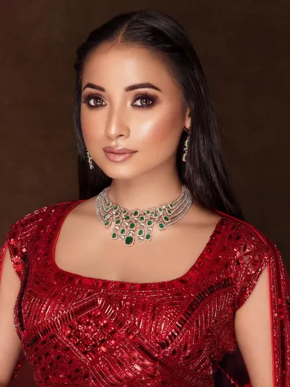 A radiant and happy portrait, capturing a natural smile and glowing skin, perfect for showcasing a reception or engagement look.