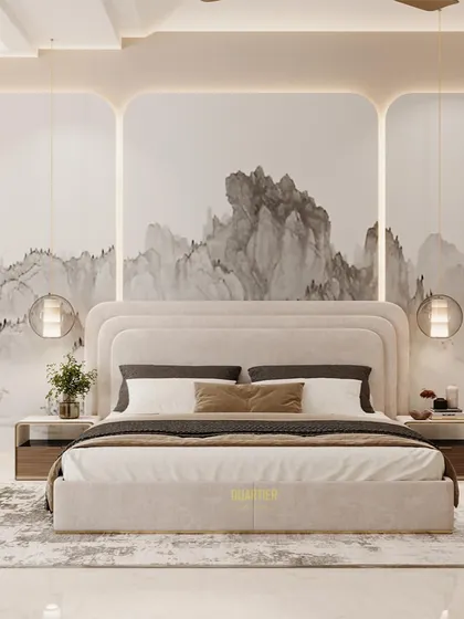 A guest bedroom design featuring a false wall with abstract wallpaper and cove lighting. The bed has a luxurious quilted, layered headboard, and the false ceiling also has a layered design.