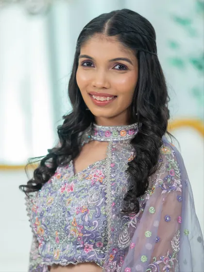 A close-up of a soft glam makeover. Notice the subtle contouring, the perfectly blended eyeshadow, and the natural-looking lip color that come together for a polished and camera-ready finish.