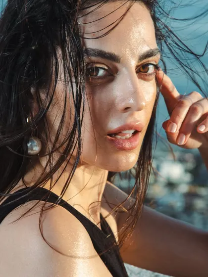 For this rooftop shoot, I created a windswept, natural look with a focus on dewy, almost wet-looking skin. The makeup is minimal to give the feeling of effortless, sun-kissed beauty.