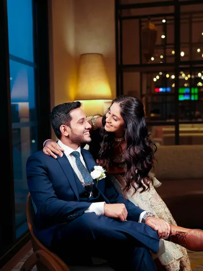 An intimate and happy moment. The bride's makeup looks soft and beautiful even in this close-up shot.